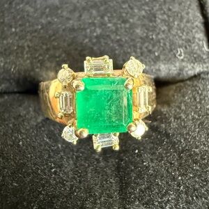 Elegant 14 k gold emerald and diamonds ring.